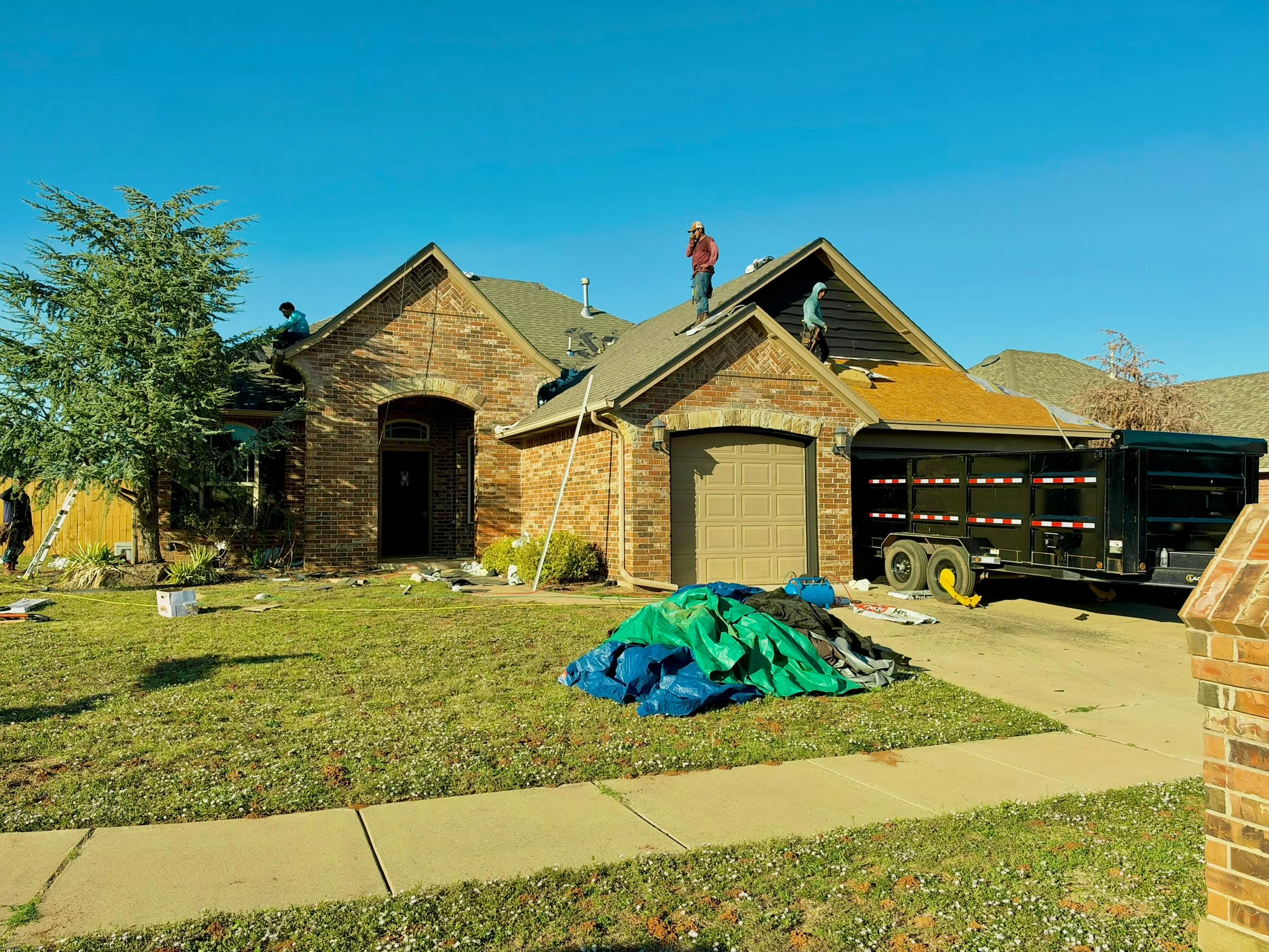 During roof replacement with crew and materials on site