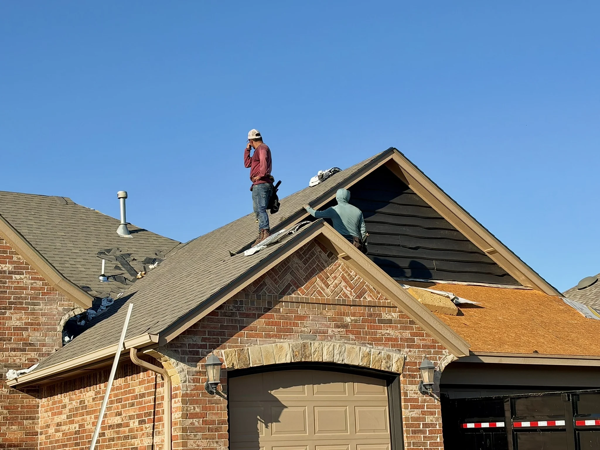 Roofing crew working during roof replacement